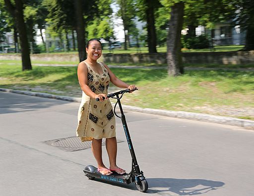 Woman Riding E-Scooter