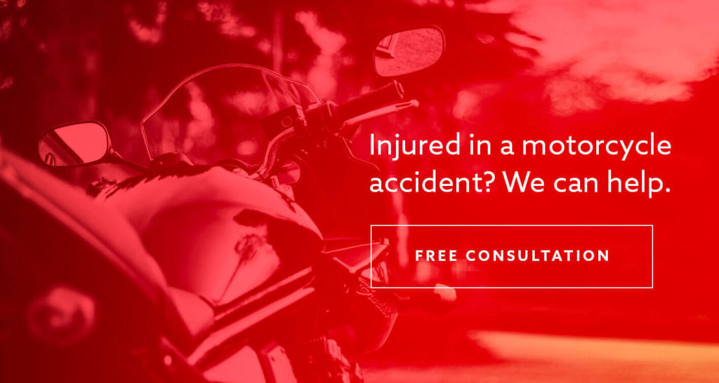 A motorcycle outside with the text "Injured in a motorcycle accident? We can help."