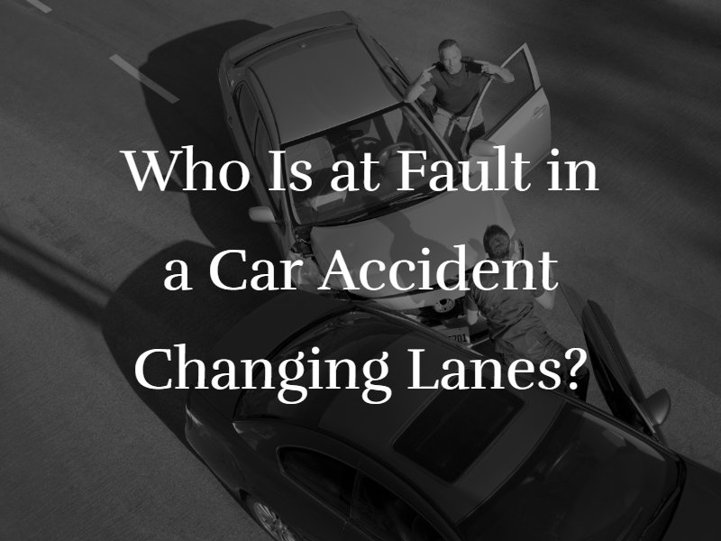 Two cars crashed on a freeway with the text "Who Is at Fault in a Car Accident Changing Lanes?" superimposed